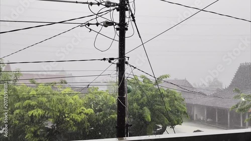Heavy Rain and Strong Winds Lash Residential Area with Power Lines.