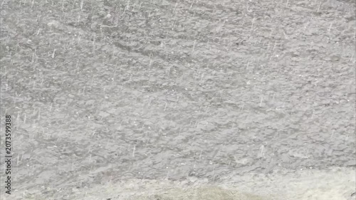 Close up of a textured gray surface with subtle color variations.