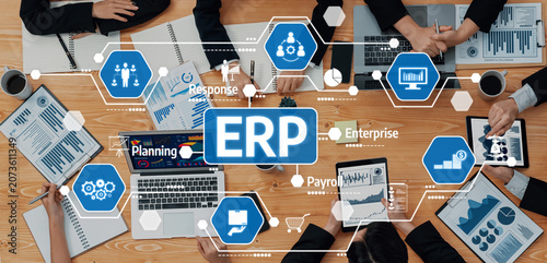 Foto A dynamic business meeting focused on ERP solutions, showcasing teamwork and advanced technology through charts, graphs, and various digital tools in a modern office setting