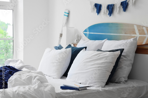 Cozy nautical bedroom with ...