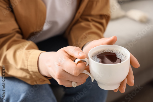 Young woman with cup of cof...