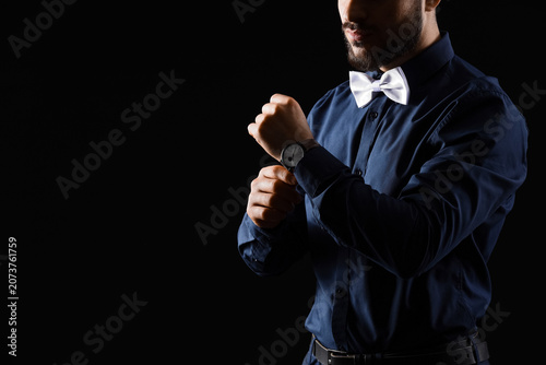 Handsome man with white bow...