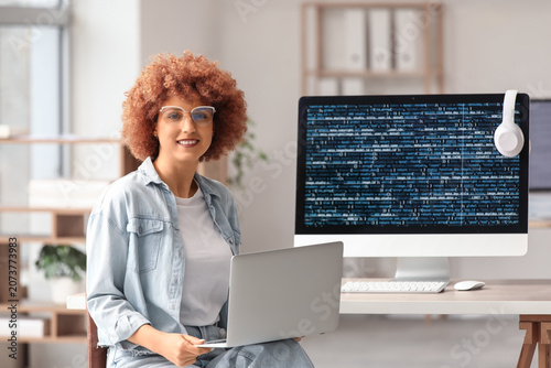 Young female programmer wor...
