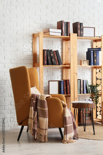 Comfortable armchair and bo...