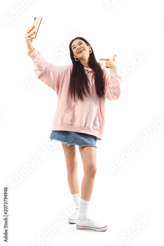 Stylish young woman in pink...