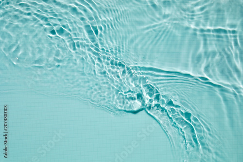 Blue swimming pool water creating ripples and wave patterns