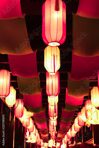 Glowing hanging lanterns at a festival