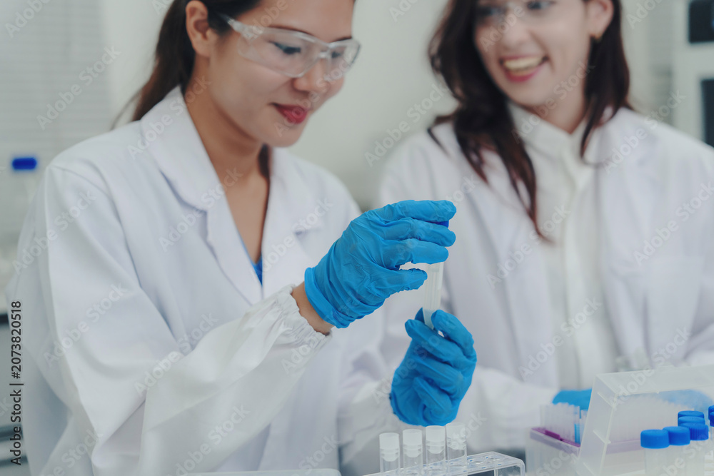 Fototapeta premium Scientists researching in laboratory finding cure