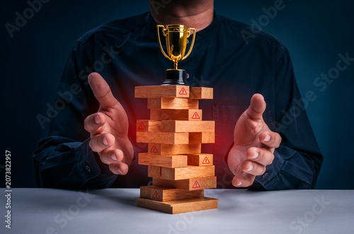 Enterprise risk management concept featuring stability tower with compliance indicators and success trophy. Internal controls, risk monitoring, crisis prevention, governance, and business resilience.