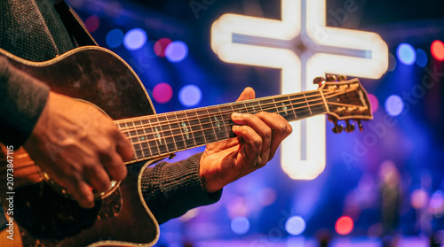 Musicians performing christian worship concert on stage with illuminated cross for audience. Religious music event, modern church service, easter celebration and spiritual gathering