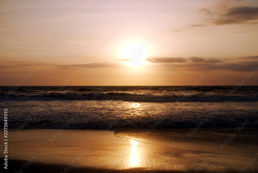 Fototapeta premium Sunset Over Ocean with Golden Reflection