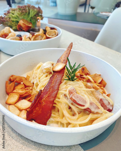 Creamy bacon pasta with crispy bacon, toasted garlic and rosemary, served as a rich Italian style comfort meal.