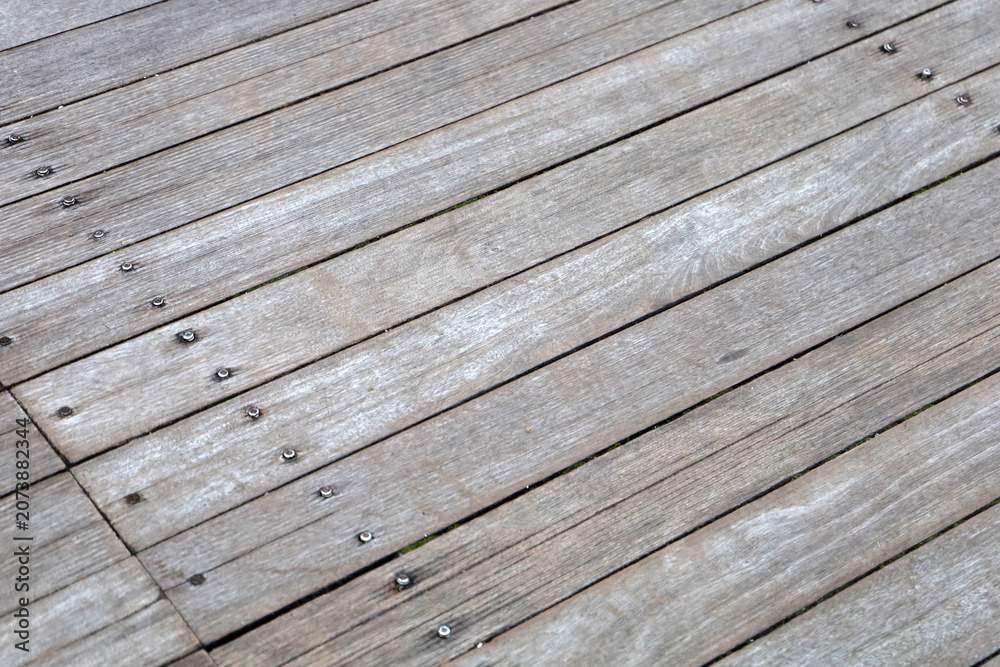 Fototapeta premium Old rustic wooden boardwalk perspective texture view