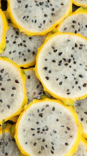 Full frame pattern of fresh sliced yellow pitahaya.