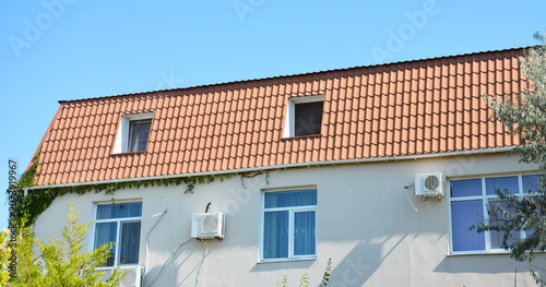 Roof roofing house gable roof pitched roof with red metal tile roofing
