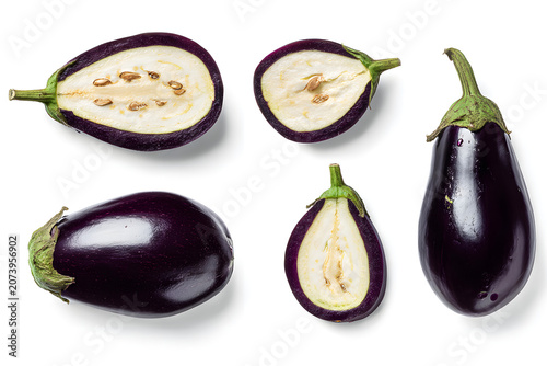 Fresh whole and sliced purple eggplants