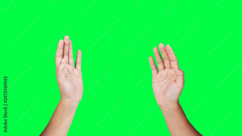 Obraz premium Hands raised on green background