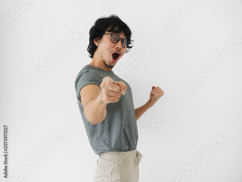 asian man asian man confidently encouraging with empowering pose, determined asian gentleman signaling action with focused expression and dynamic isolated on white background