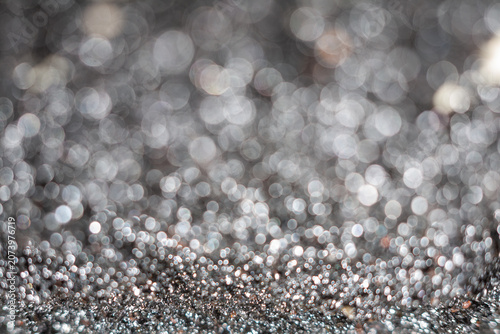 Close-up view of shiny metallic texture with blurred background