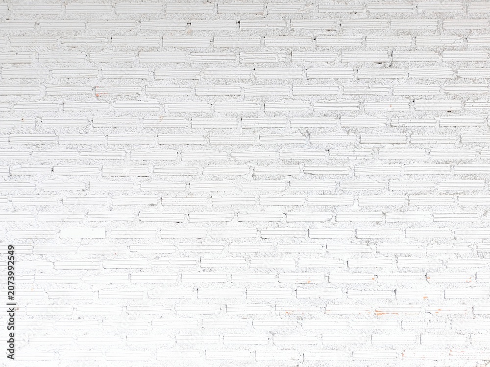 Fototapeta premium White brick wall background texture abstract perspective view of rustic white painted brick wall surface for interior design and modern architecture backdrop.