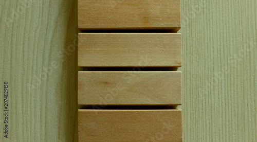 Obraz na plátně A background of wooden planks lying on a board with a perpendicular pattern