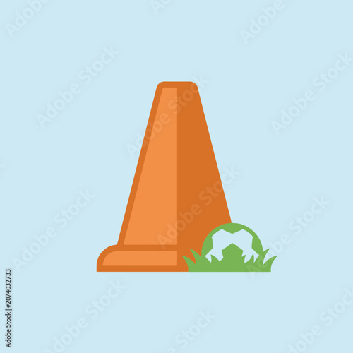 An orange traffic cone stands beside a ball on the grass