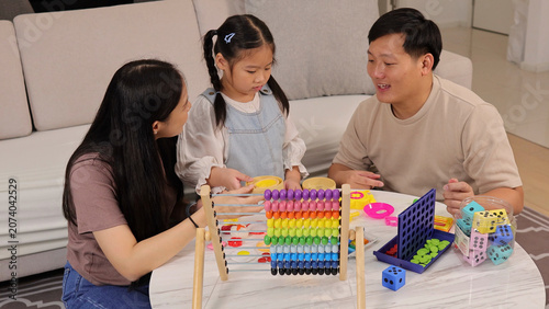 Photos Asian Family Playing with Abacus and Educational Games at Home