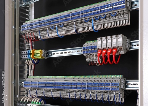 Marking electrical wiring wires with thermally printed nylon tape. 