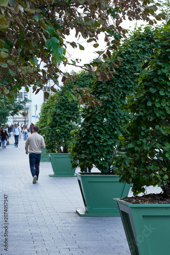 Pedestrians walk along a street in the city center, Russia, August 14, 2025.