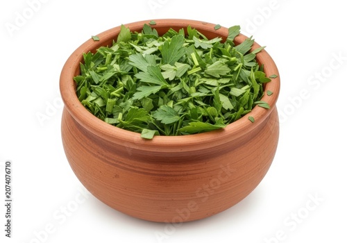 Fresh green leafy salad in a wooden bowl on a table
