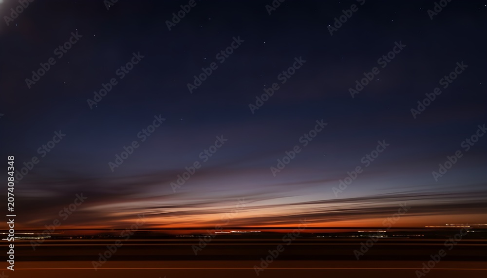 Naklejka premium Dusk-to-night sky transition motion blur