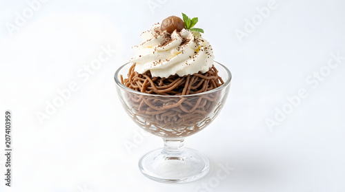 Traditional Vermicelles sweet chestnut puree with whipped cream, isolated on white. Excellent for autumn dessert menus and culinary designs