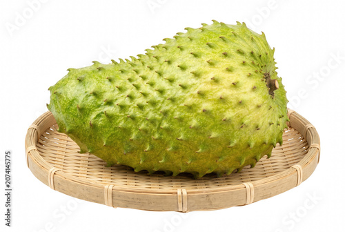 Fotografía Fresh Whole Soursop Fruit Resting On A Woven Bamboo Tray