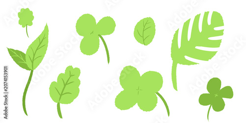 Tableau sur toile A collection of various green leaves and plant elements, including clover, simple leaves, and lobed foliage, depicted in a flat, illustrative style on a white background