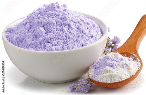 Purple powder in bowl, spoon, flowers. Soft light