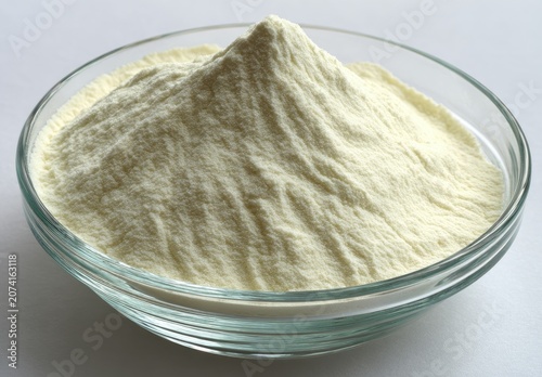 Powdered substance piled high in clear glass bowl