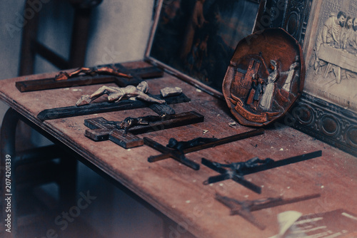 Vintage religious objects and crucifixes inside an old chapel