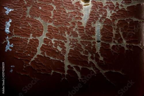 Obraz na plátne Damaged dark synthetic leather sofa