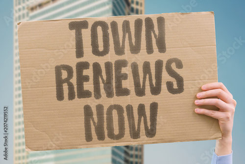 Tableau sur toile "Town renews now" Community revitalization is urgent