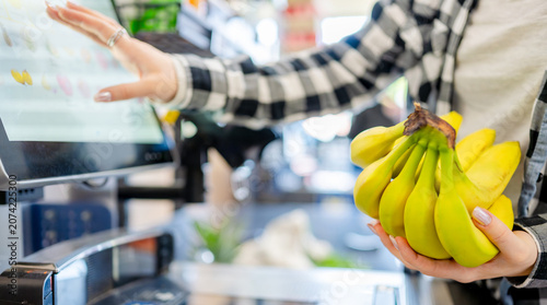 Photography Girl At Self-Checkout Scanning Items