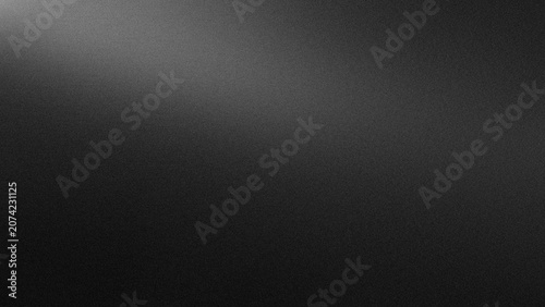 Abstract dark background with subtle light gradient and textured surface.