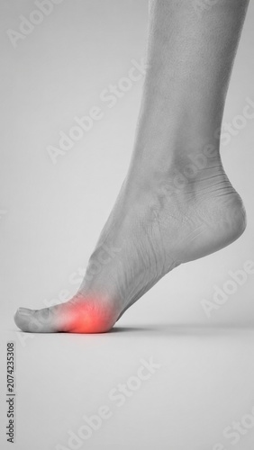 A human foot features a bright red glow highlighting pain and inflammation on the big toe joint.