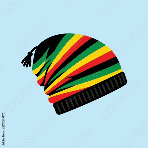 Fotografie A colorful rasta beanie hat with stripes on blue background