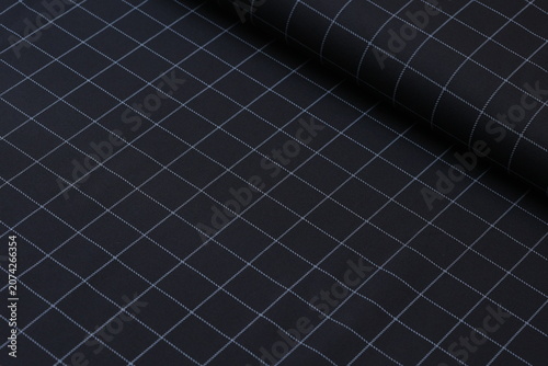 фотографія Premium cotton suiting fabric featuring a clean grid windowpane pattern in black and white lines