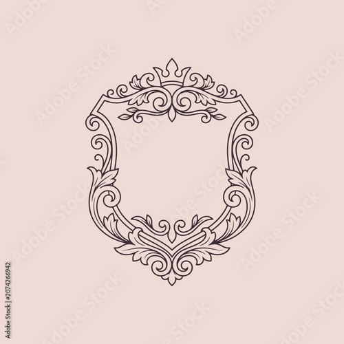 An elegant vintage ornamental shield frame on a soft background