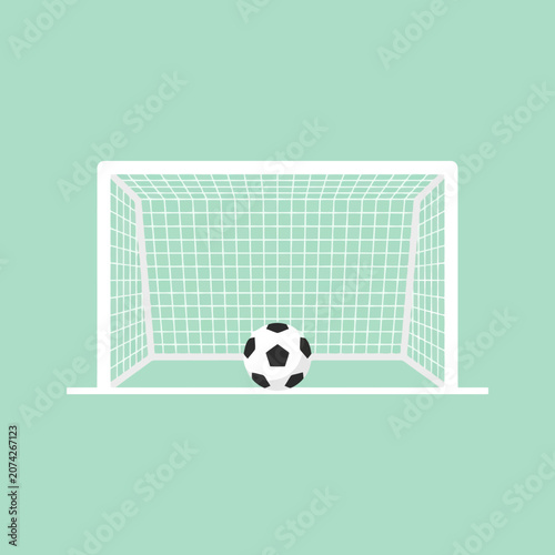Classic soccer ball sits inside a white goal on a green field