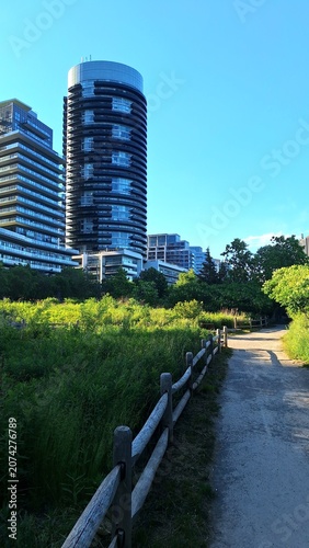 Photography Modern apartment buildings overlooking a lush urban green park space