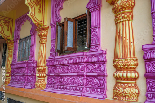 Valokuva An exterior shot of a local Hindu temple in the suburban neighbourhood of Kharadi, showcasing traditional Indian temple architecture, intricate carvings and devotional details