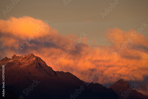 Silhouette of distant mountains against the golden evening glow.