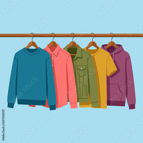 Tableau sur toile Colorful casual clothes hanging on a wooden rack